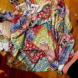 Worn twice designer top. Washes well. Matches with many outfits. Size M